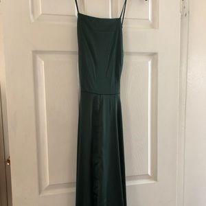Emerald green, floor length gown.